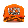 heavy metal hounds trucker hat | corgi | orange camo