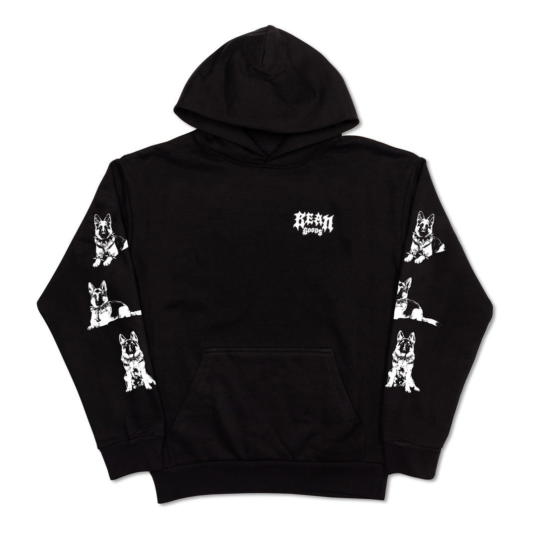 A black pullover hoodie with a white gothic-style 'BEAN GOODS' logo on the chest and white graphic prints of German Shepherd dogs on both sleeves, shown against a plain white background.