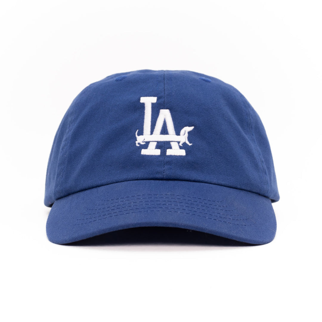 Bean Goods blue baseball cap with white LA weens logo on a white background