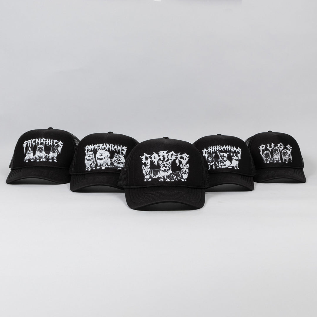 Five black baseball caps with white graphic designs on a light gray background