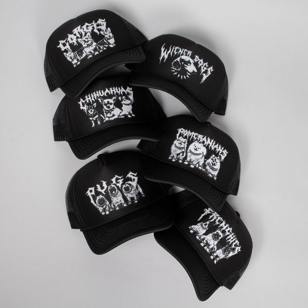 Black caps with white graphic designs on a light gray background