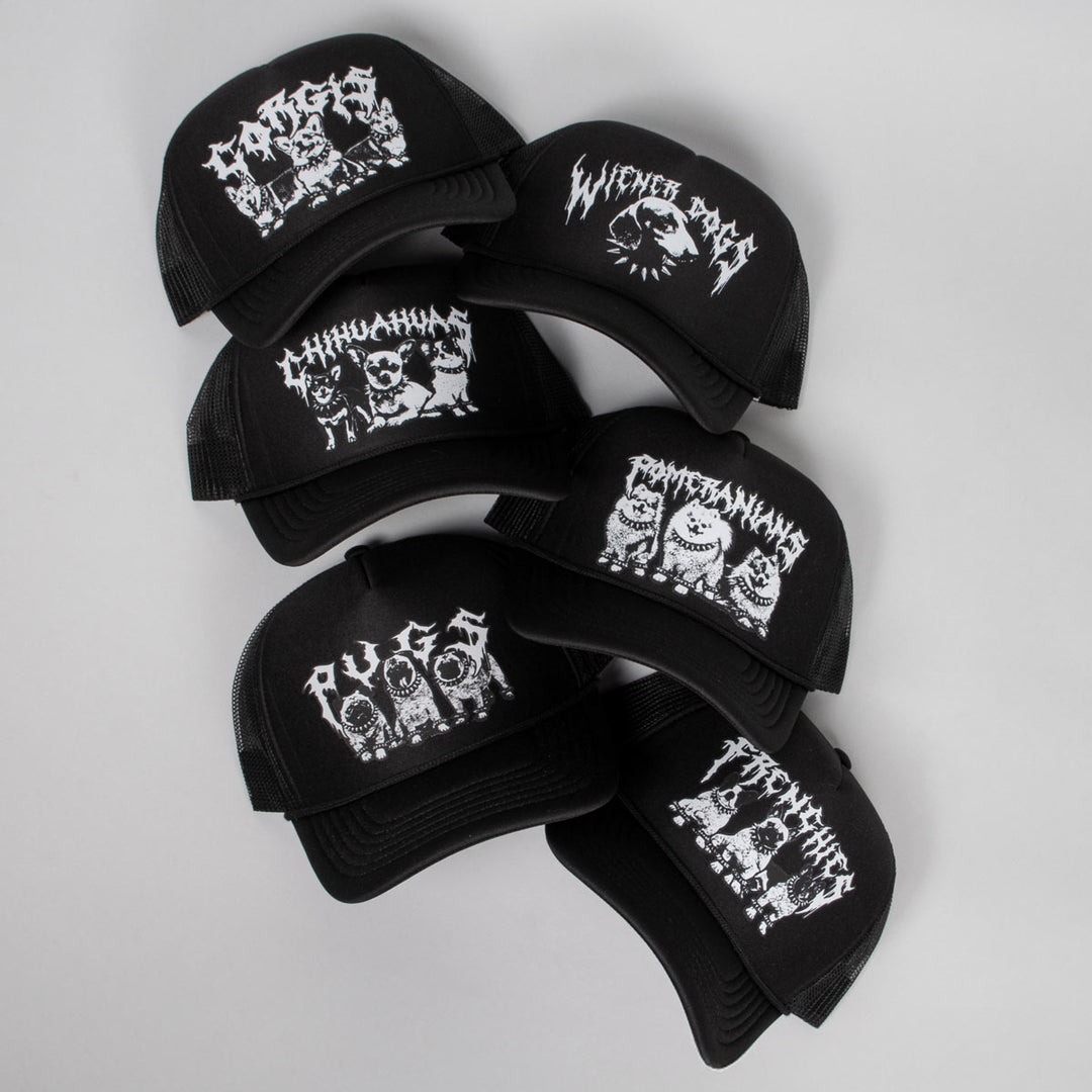 Black caps with white graphic designs on a light gray background