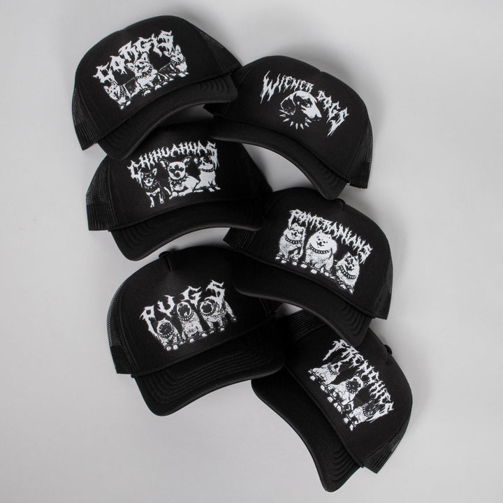 Black caps with white graphic designs on a light gray background