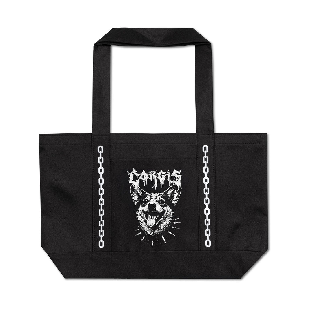A black canvas tote bag with two top handles, featuring a white graphic print of a spiky dog head and the word 'CORGIS' in a metal-style font on the front. White chain graphics run vertically down both sides of the bag.