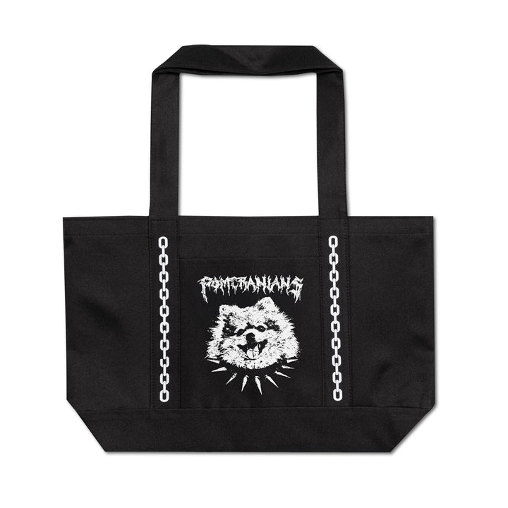 A black canvas tote bag with white printed graphics, featuring the band name 'Pomeranian' in a jagged font above a stylized dog head and chain-link illustrations running down the sides.