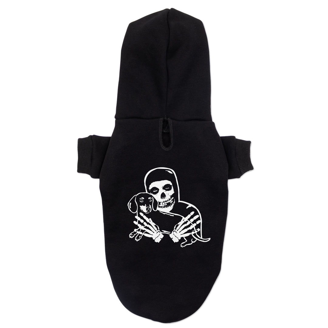 Small black pet pullover hoodie featuring a white graphic of a crimson skeleton figure holding a small dachshund, shown against a plain white background.